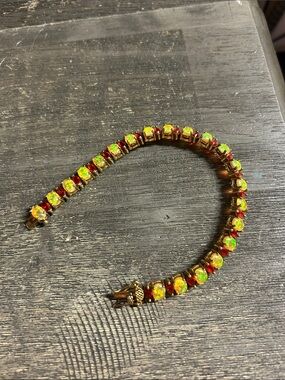 Fire Opal/Ruby Tennis Bracelet
Stamped DBJ
Dee Berkeley
Gold plated .925
7.5 “